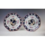 A pair of Chinese porcelain octagonal chargers, Qianlong period, each decorated with a central