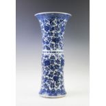 A 19th century Chinese porcelain blue and white Gu vase, of phoenix tail form, extensively decorated