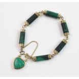 A Victorian malachite link memorial bracelet, suspending a yellow metal malachite set heart-shaped