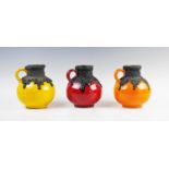 Three West German fat lava jug vases, mid-century, by Roth Keramik, in red, yellow and orange,