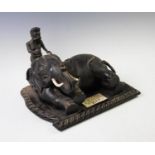 A Indian carved ebony and ivory mounted model of an elephant and bather, circa 1900, presentation