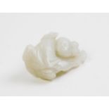 A Chinese white jade figure of a boy holding a ruyi branch, 4.2cm high