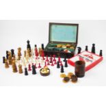 An assorted collection of chess and backgammon pieces, to include; a Jaques style, St George pattern