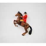 A Beswick wall plaque modelled as a huntsman on rearing horse, model 1505, maker's mark verso,