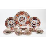 A pair of Japanese Imari porcelain chargers, Meiji period, decorated with floral panels, 22cm