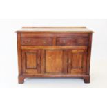 A George III oak dresser base, with a rectangular moulded plank top above a pair of frieze drawers