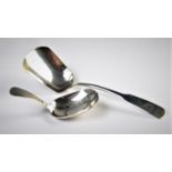 A George III silver fiddle pattern caddy spoon 'I T', Birmingham 1797,11.8cm long, with a further
