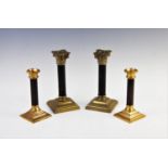 A Pair of Victorian brass Corinthian column candlesticks, with painted columns and stepped