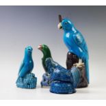 A Chinese sancai glazed parrot, 19th century, modelled standing on a rocky outcrop, 21cm high with