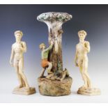 A plaster of paris jardiniere stand, mid 20th century, modelled as a young girl climbing a tree