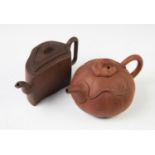A Chinese Yixing teapot and cover, modelled as a pumpkin with vine leaf decoration, 19cm long with a