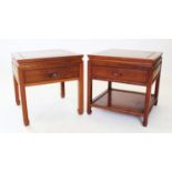 A near pair of Japanese influence rosewood lamp/bedside tables, each table with a frieze drawer
