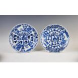 A pair of Chinese porcelain blue and white plates, Kangxi mark but later, each of lobed circular