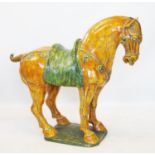 A large Chinese sancai glazed pottery model of a Bactrian horse in the Tang dynaasty style, 83cm