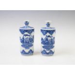 A pair of Chinese porcelain blue and white Rouleau vases, 20th century decorated with bouquets of