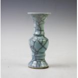A Chinese Ge-Ware beaker vase, of typical Gu form with an all-over celadon glaze, 15.8cm high