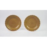 A pair of Wedgwood buff-glazed sunflower moulded circular plates, 22cm diameter (2)