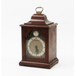 A walnut cased presentation bracket clock, mid 20th century, the pagoda shaped case with a gilt