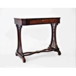 A Victorian rosewood work or side table, the top of rectangular waisted form with canted corners