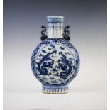 A Chinese porcelain blue and white moon flask, early 19th century, of typical form decorated to each