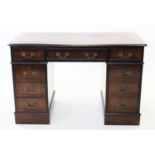 A reproduction twin pedestal desk, late 20th century, with a serpentine top inset with a leather