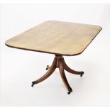A George III mahogany pedestal breakfast table, circa 1800, the rectangular top with rounded