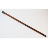 A Burmese white metal topped malacca walking cane, with repousse work knop, 82cm long (at fault)