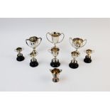 A collection of miniature silver trophies, to include a George V example, Edward Barnard & Sons Ltd,