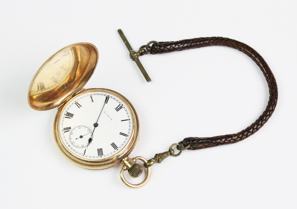 An Elgin 9ct gold full hunter pocket watch, white enamel dial with black roman numerals and