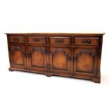 A George III style stained ash dresser base by Sitting Firm, late 20th century, the rectangular