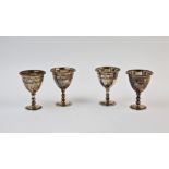 A set of four Victorian silver egg cups, Walker & Hall, Sheffield 1878, each with chalice form