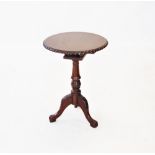 A Chippendale style mahogany tripod table, 20th century, the circular top with a gadrooned border,