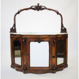 A Victorian marble top mirror back chiffonier, the arched mirror back with a carved open work