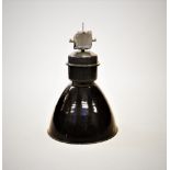 An industrial metal lamp, mid 20th century, of typical domed form with a white enamelled interior,