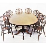 A George III style stained ash dining table and eight chairs by Sitting Firm, late 20th century, the