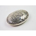 A 19th century Dutch silver snuff box, of oval form, the cover decorated with embossed figures on