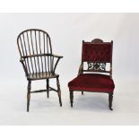 A Victorian walnut and upholstered low seat chair, with a button padded back above a carved open