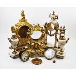 A 19th century French ormolu clock case, surmounted with a cherub figure, raised upon leafy scroll