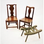 An early 18th century oak chair, with a cupids bow top rail above a vase shaped splat and board