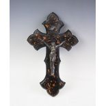 A 19th century white metal and tortoiseshell mounted crucifix, designed with a white metal cast