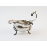 A George V silver sauce boat, William Neale, Birmingham 1921, of typical plain polished form, with