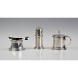 A silver condiment set, William Comyns & Sons Ltd, London 1937, comprising; a pepperette, wet