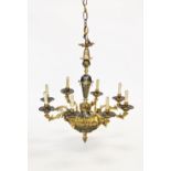 An early 20th century French style eight branch chandelier, the tapering steel central column