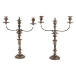 COPPIA CANDELABRI a due fiamme in metallo argentato. Inghilterra XIX secolo Misure: h cm 55,5