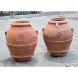 COPPIA ORCI in terracotta. Sicilia XX secolo Misure: h cm 64