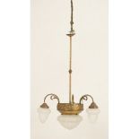 LAMPADARIO in ottone dorato a quattro luci con bocce in vetro satinato. Sicilia primi '900 Misure: h