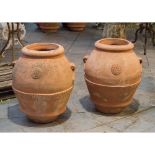 COPPIA ORCI in terracotta. Sicilia XX secolo Misure: h cm 64