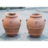 COPPIA ORCI in terracotta. Sicilia XX secolo Misure: h cm 64