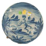 PIATTO in ceramica smaltata e decorata raffigurante "Paesaggio con putto" (difetti). Liguria XVIII