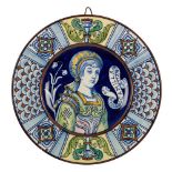 PIATTO in ceramica smaltata e decorata raffigurante "Bella Camilla". Italia centrale XIX secolo
